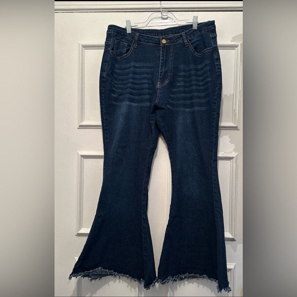 Blue Jeans. Size XL. Fit like an 18P. Bell bottoms with fraying.